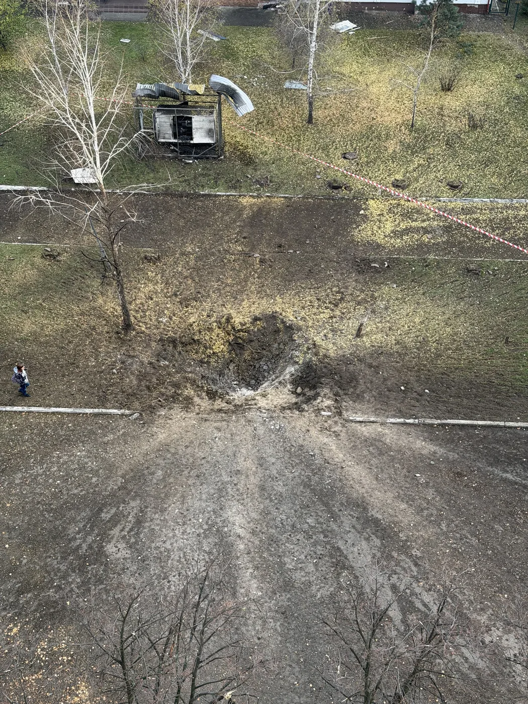 The crater left by the missile strike near the State Transport University dormitory in Kyiv, October 2026