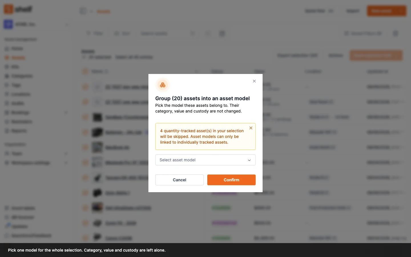The Group assets into an asset model dialog, warning that quantity-tracked assets in the selection will be skipped